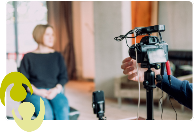 A picture of a camera filming someone